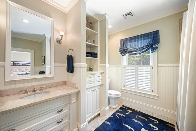 a spacious bathroom with a double vanity sink a mirror and a shower