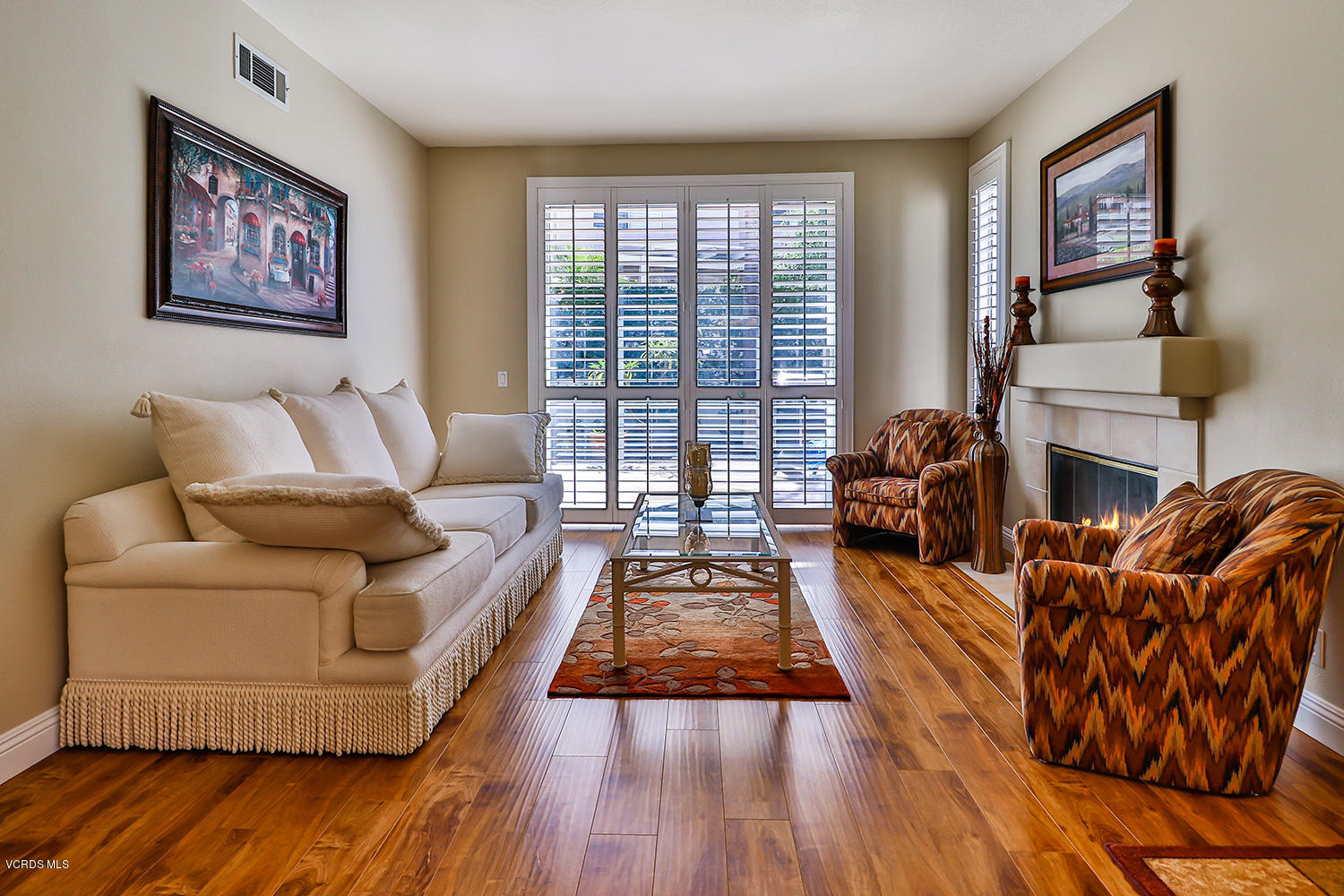 4044 Milano Place Moorpark, CA 93021 - Photo 3 of 29 a living room with furniture and a fireplace