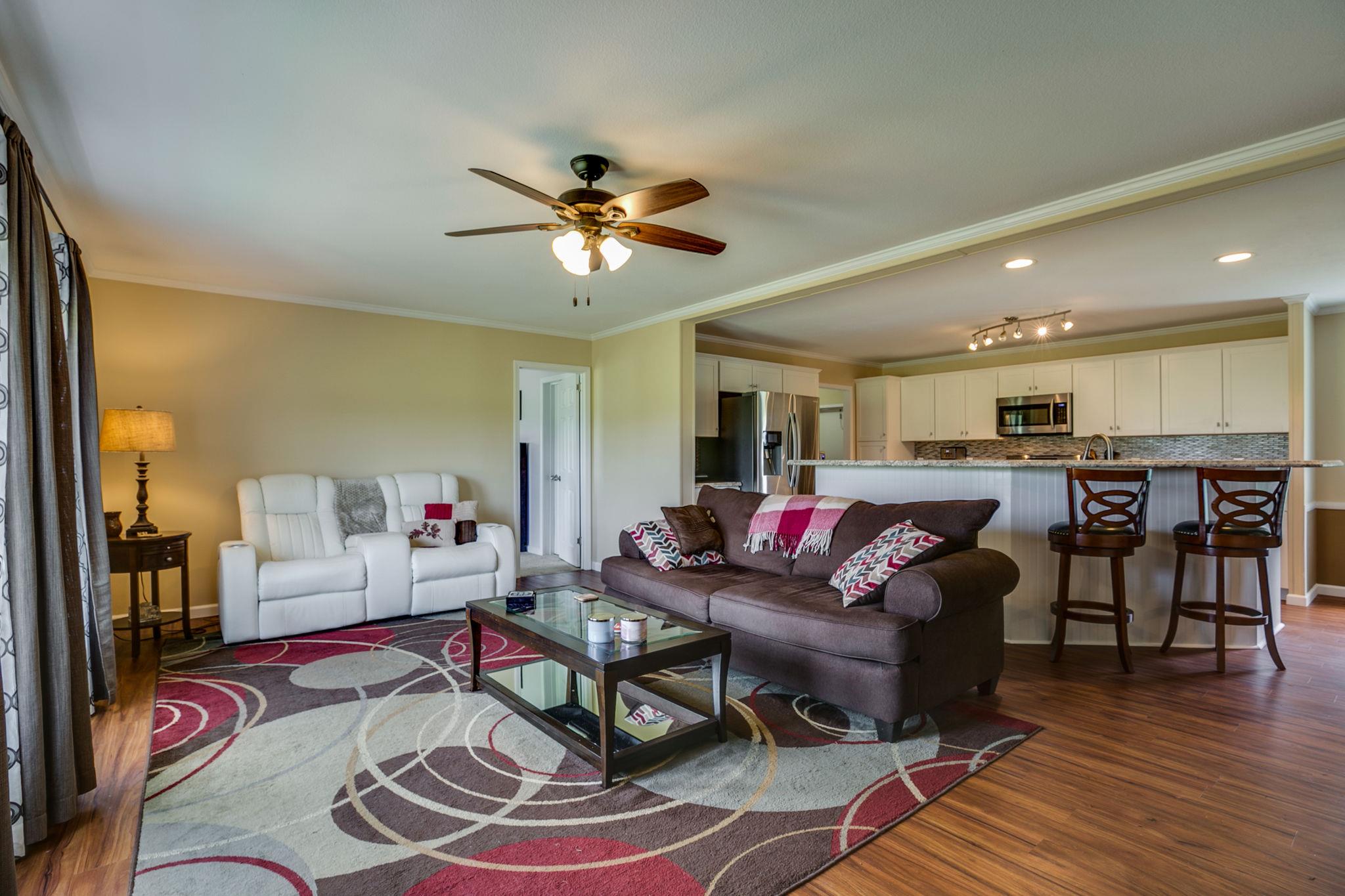 513 Ferrells Loop Road Manchester, TN 37355 - Photo 3 of 29 a living room with furniture kitchen view and a wooden floor