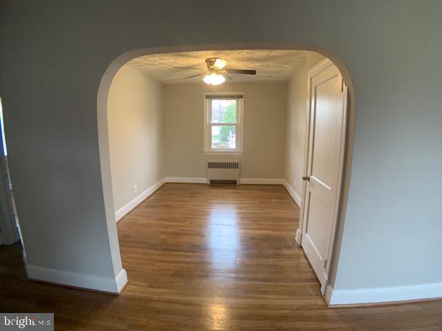 205 Twin Oaks Road Linthicum, MD 21090 - Photo 5 of 16 a view of empty room with wooden floor and fan