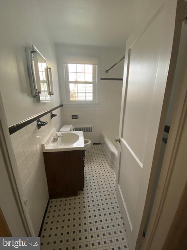 205 Twin Oaks Road Linthicum, MD 21090 - Photo 10 of 16 a bathroom with a sink toilet and shower