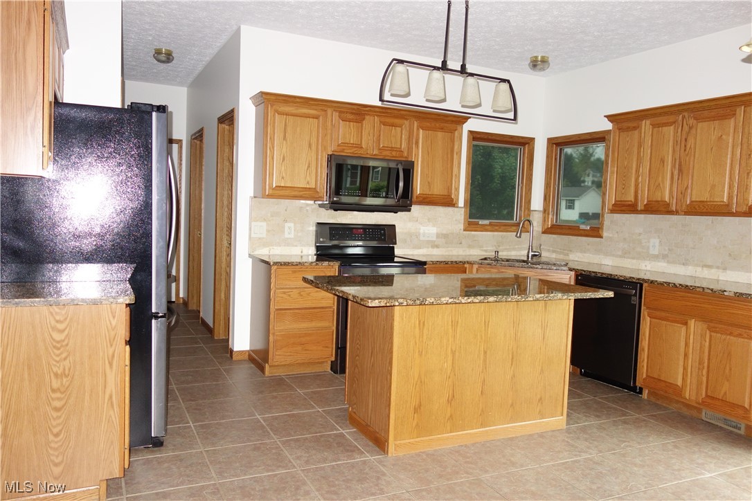 4891 Edson Road Kent, OH 44240 - Photo 16 of 48 Lovely Granite countertops and a large Island
