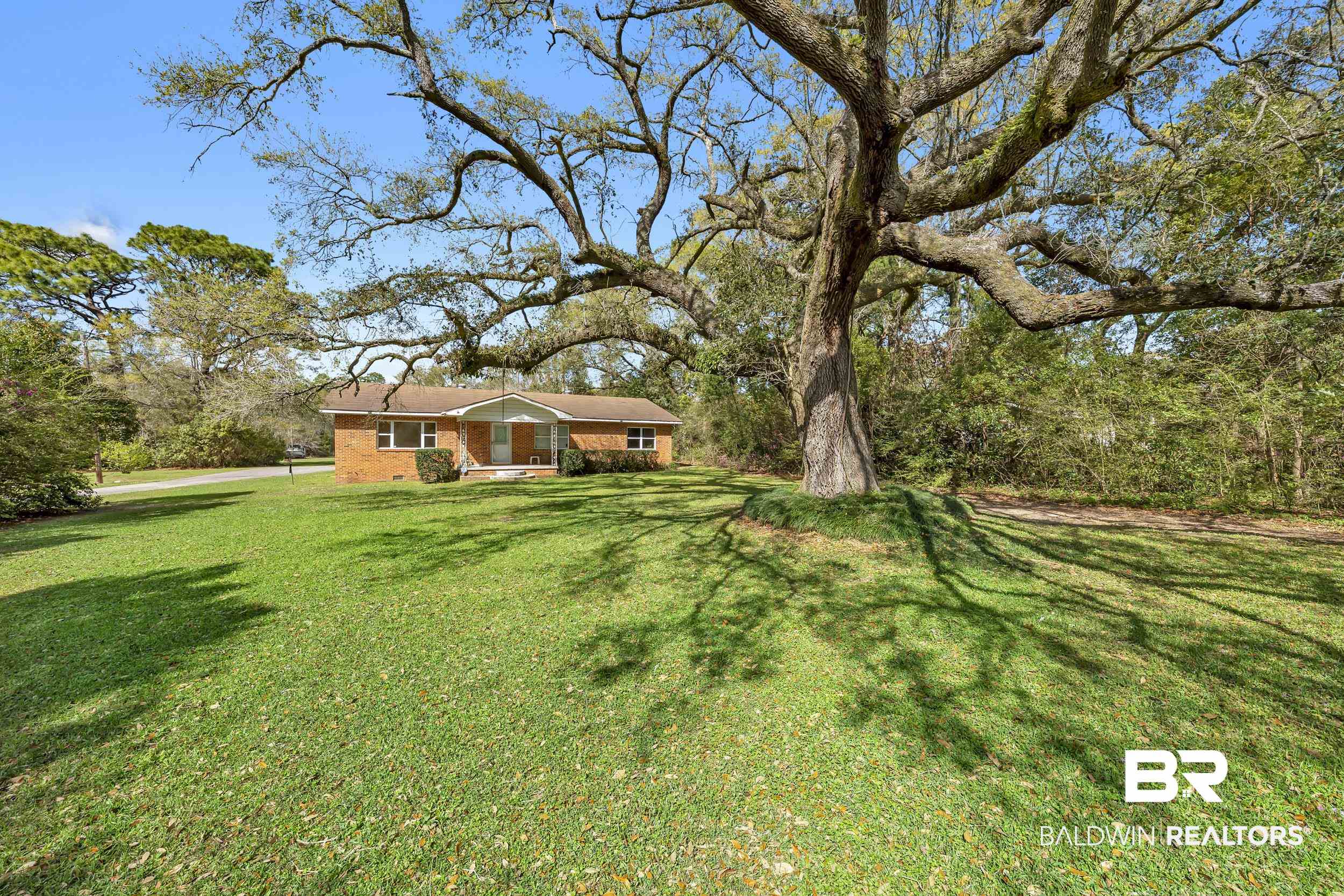 17463 Highway 98 Foley, AL 36535 - Photo 29 of 57 View of green lawn with view of wooded area