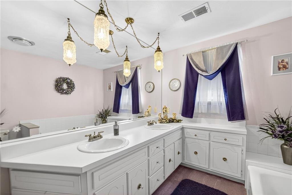 224 Rehoboth Road Belle Vernon, PA 15012 - Photo 17 of 46 a bathroom with a sink vanity and a mirror