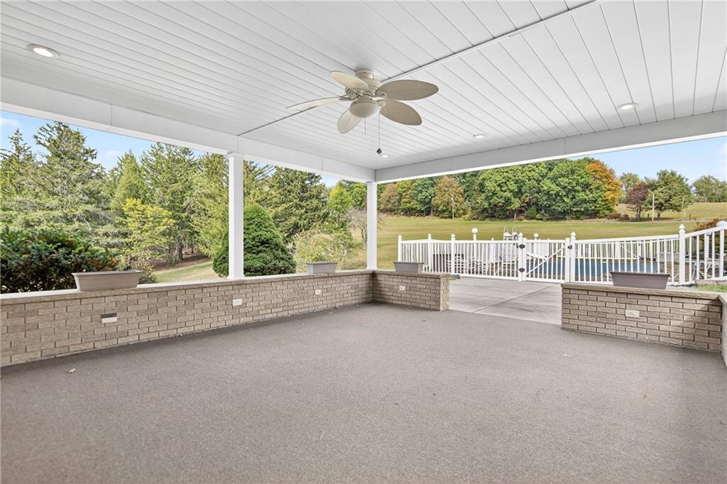 224 Rehoboth Road Belle Vernon, PA 15012 - Photo 34 of 46 an empty room with large windows and ceiling fan