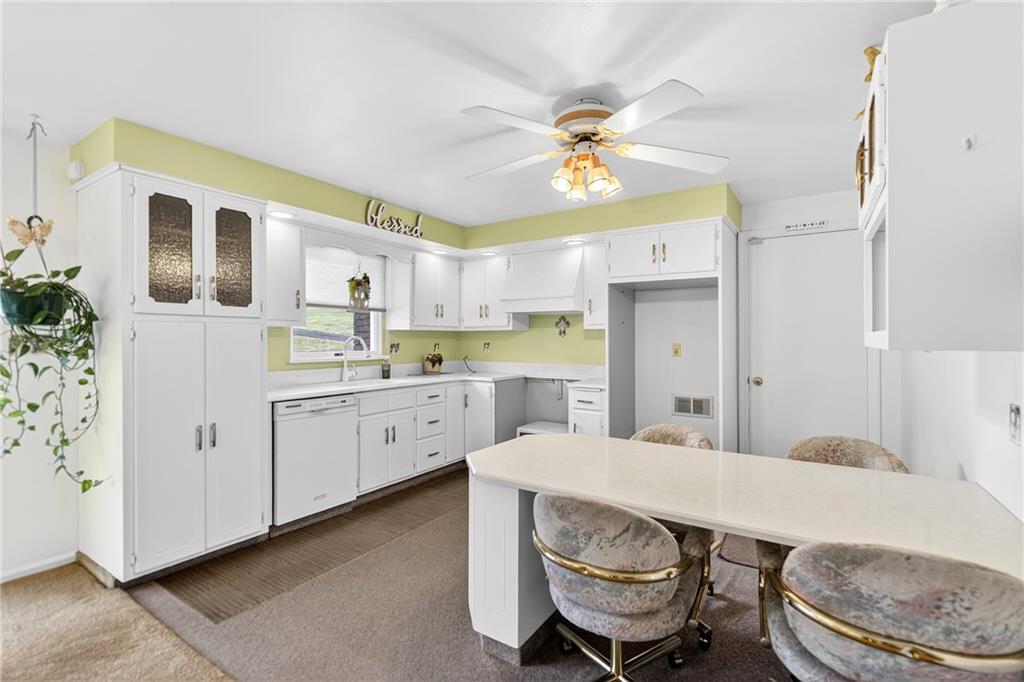 224 Rehoboth Road Belle Vernon, PA 15012 - Photo 9 of 46 a kitchen that has a lot of white cabinets a sink and appliances