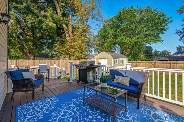 swimming pool view with a seating space