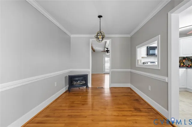 a view of a room with wooden floor and staircase