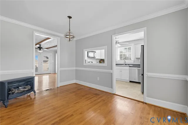a view of a kitchen with a stove cabinets and wooden floor