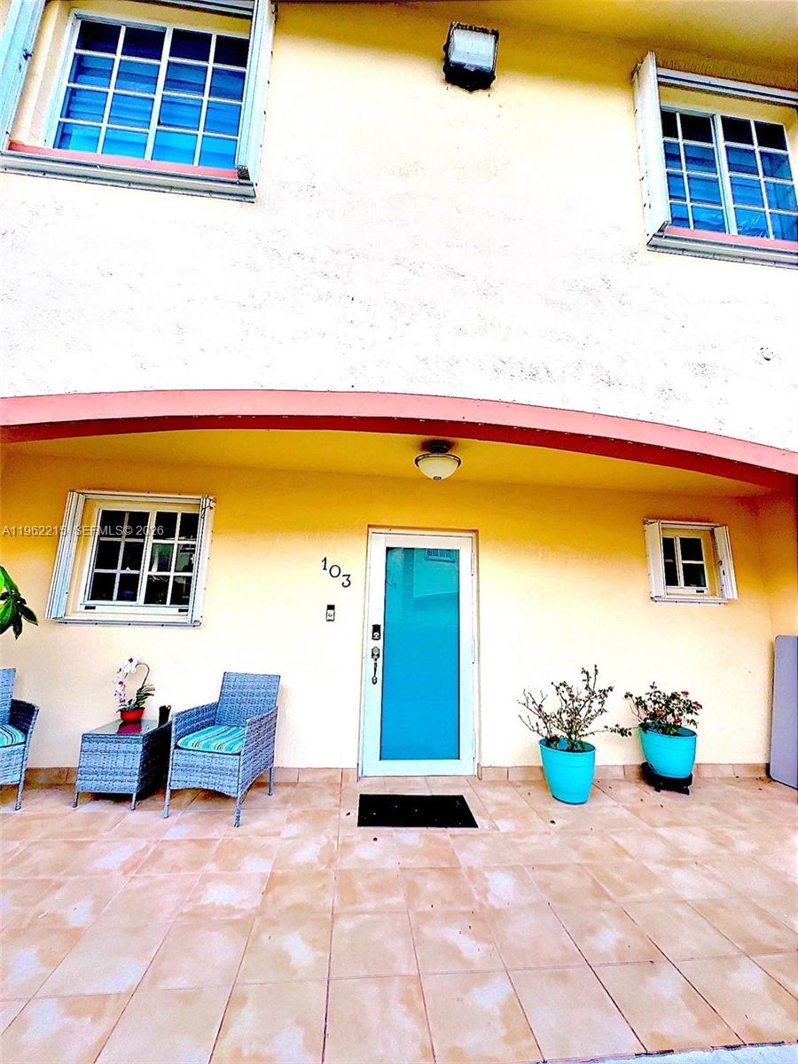 6761 Northwest 182nd Street, Unit 103 Hialeah, FL 33015 - Photo 1 of 13 a view of a lounge chairs in the patio
