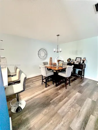 a living room with furniture a rug and a table