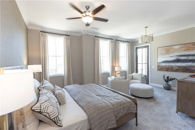 a bedroom with a bed couch and window