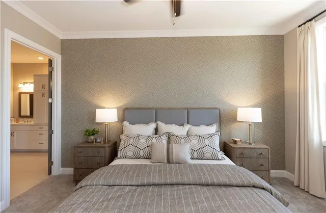 a bedroom with a bed and a night stand