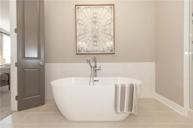 a white bath tub sitting in a bathroom
