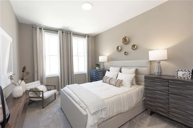 a bedroom with a bed couch and window