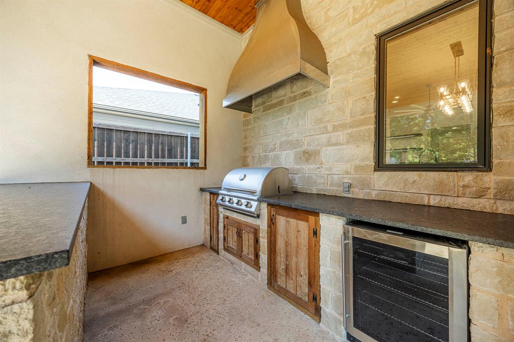 2081 Holt Way Grapevine, TX 76051 - Photo 13 of 40 a kitchen with granite countertop a stove and a sink