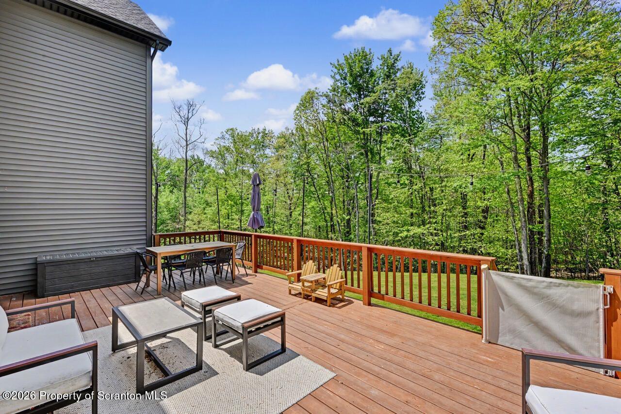 100 Highland Road Moscow, PA 18444 - Photo 78 of 85 a view of a chairs and table on the wooden deck