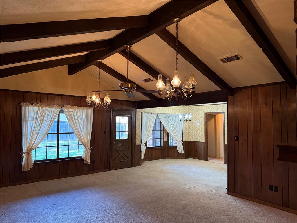 3822 Pines Road Shreveport, LA 71119 - Photo 4 of 4 an empty room with windows and chandelier