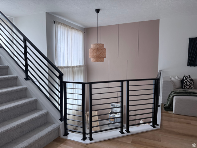 774 West 480 South American Fork, UT 84003 - Photo 40 of 76 Upper-level landing featuring wood-finish flooring and contemporary black metal horizontal bar railing