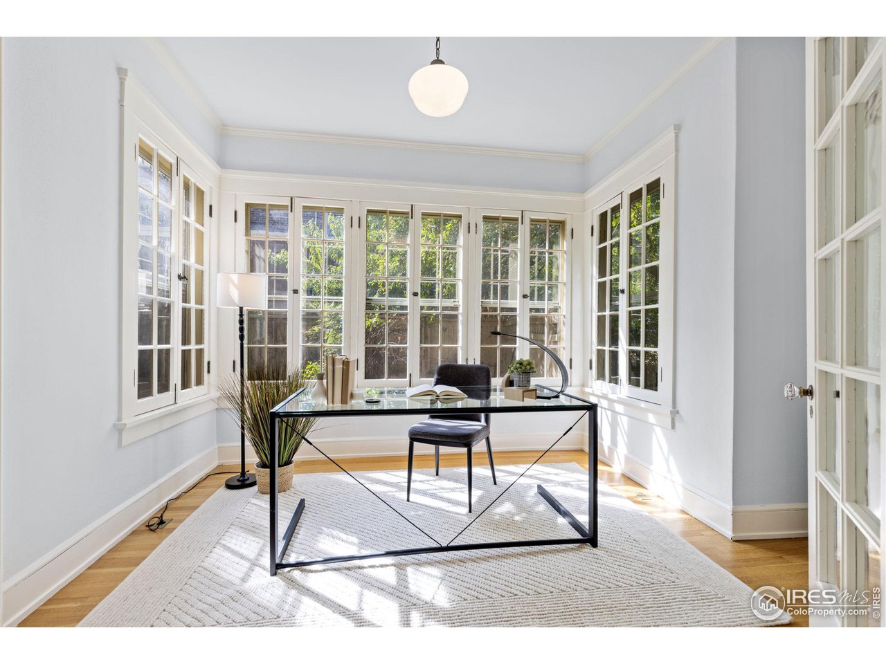 1064 10th Street Boulder, CO 80302 - Photo 13 of 40 a view of a workspace with furniture and a window