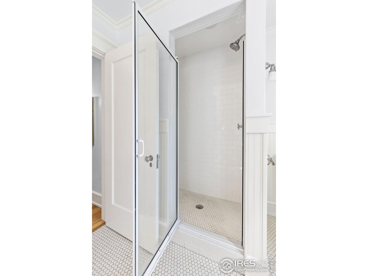 1064 10th Street Boulder, CO 80302 - Photo 18 of 40 a bathroom with a shower and a mirror