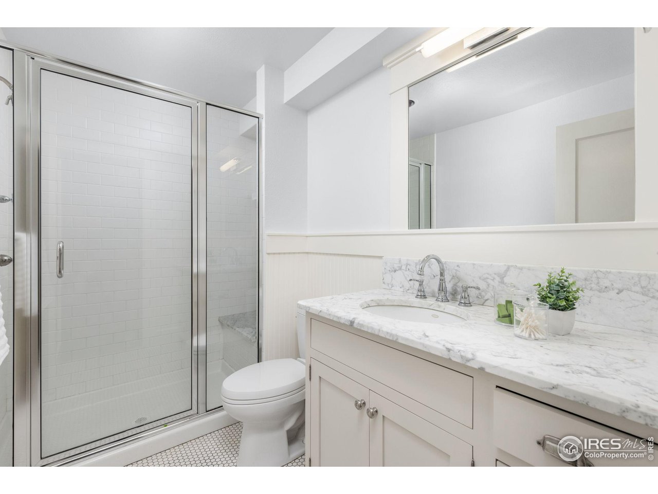 1064 10th Street Boulder, CO 80302 - Photo 26 of 40 a bathroom with a granite countertop sink toilet and shower