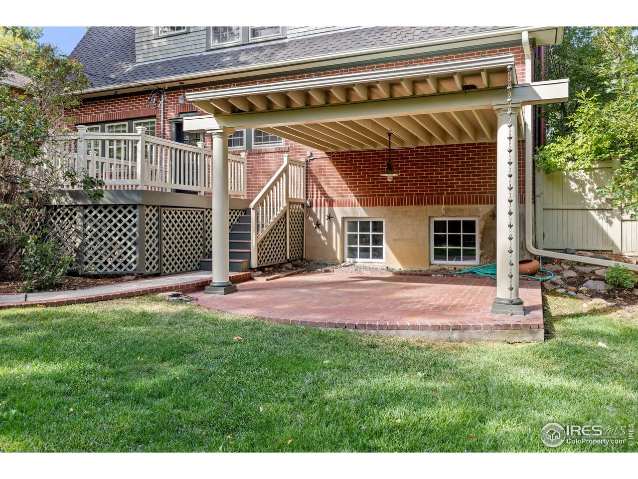 1064 10th Street Boulder, CO 80302 - Photo 28 of 40 a view of a backyard with a barbeque grill and plants