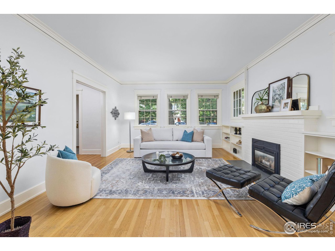 1064 10th Street Boulder, CO 80302 - Photo 3 of 40 a living room with furniture and a fireplace