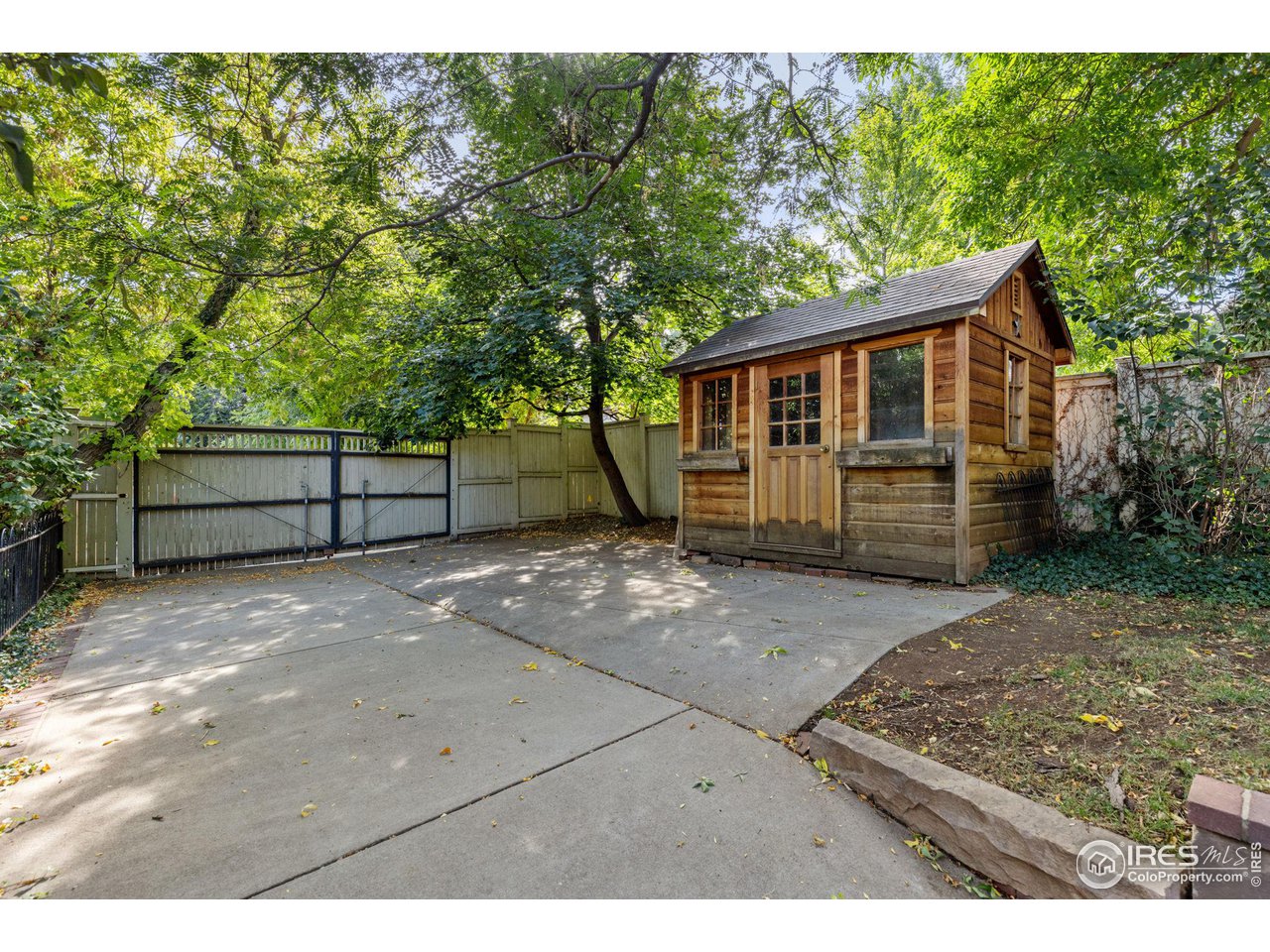 1064 10th Street Boulder, CO 80302 - Photo 33 of 40 a view of a house with a backyard