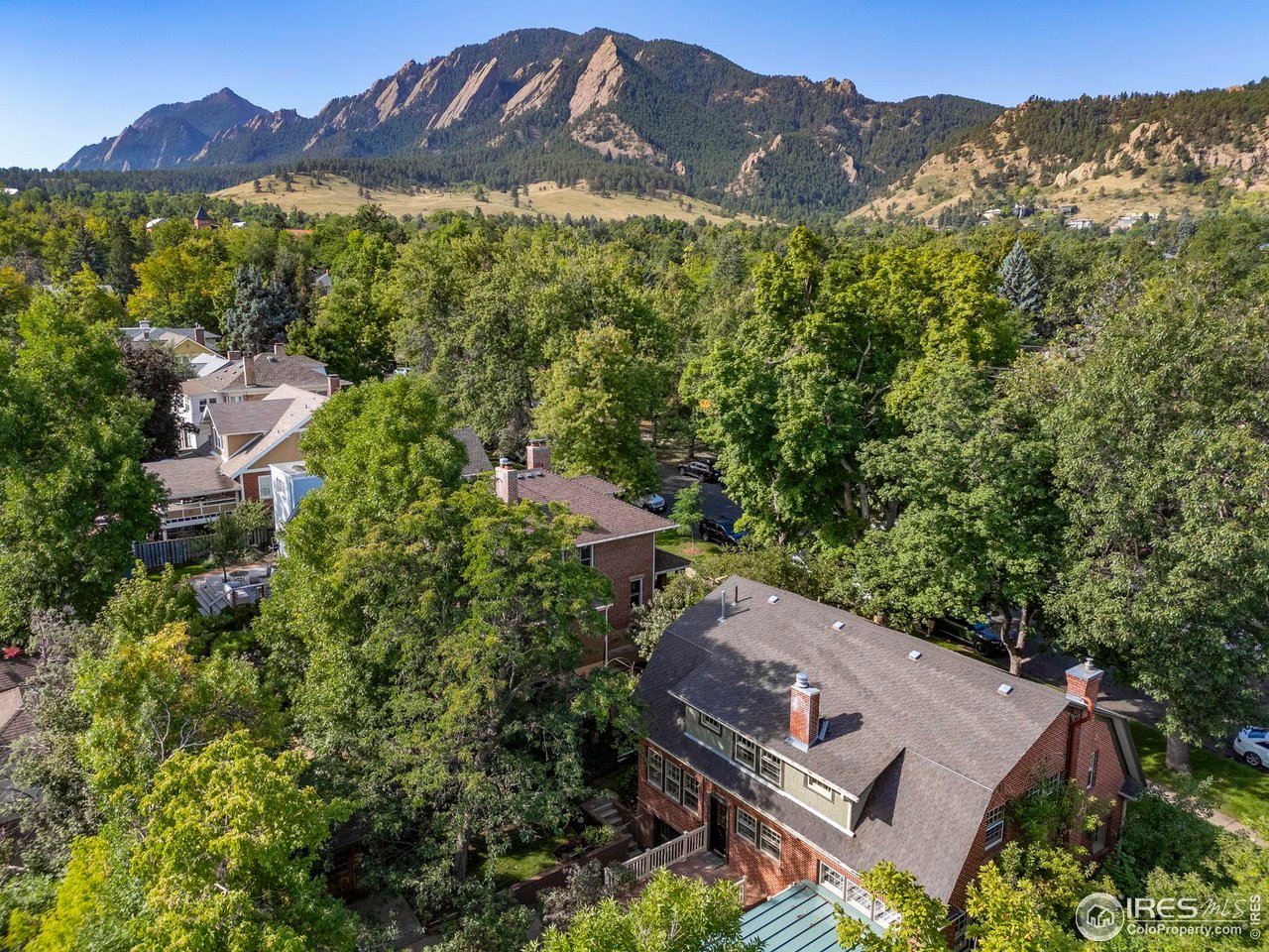1064 10th Street Boulder, CO 80302 - Photo 38 of 40 an aerial view of a house with a mountain in the background