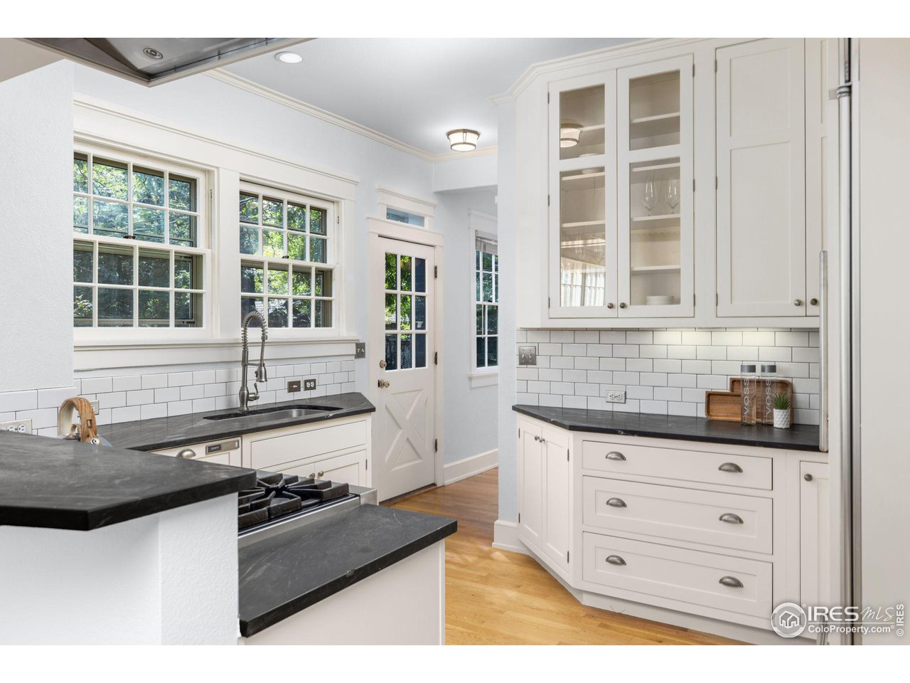 1064 10th Street Boulder, CO 80302 - Photo 5 of 40 a kitchen with granite countertop a stove a sink and a granite counter tops