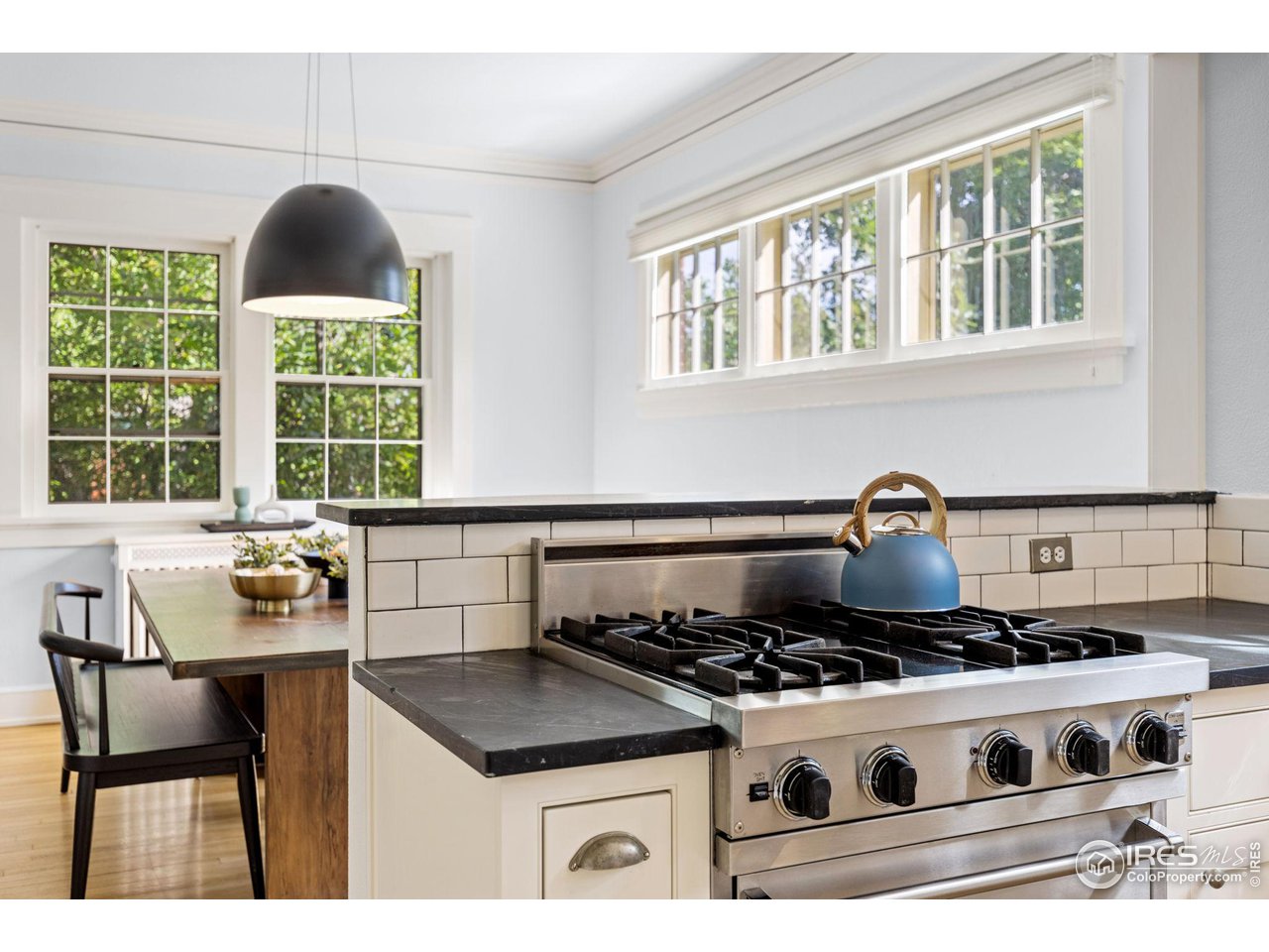 1064 10th Street Boulder, CO 80302 - Photo 7 of 40 a kitchen with a stove and a chair