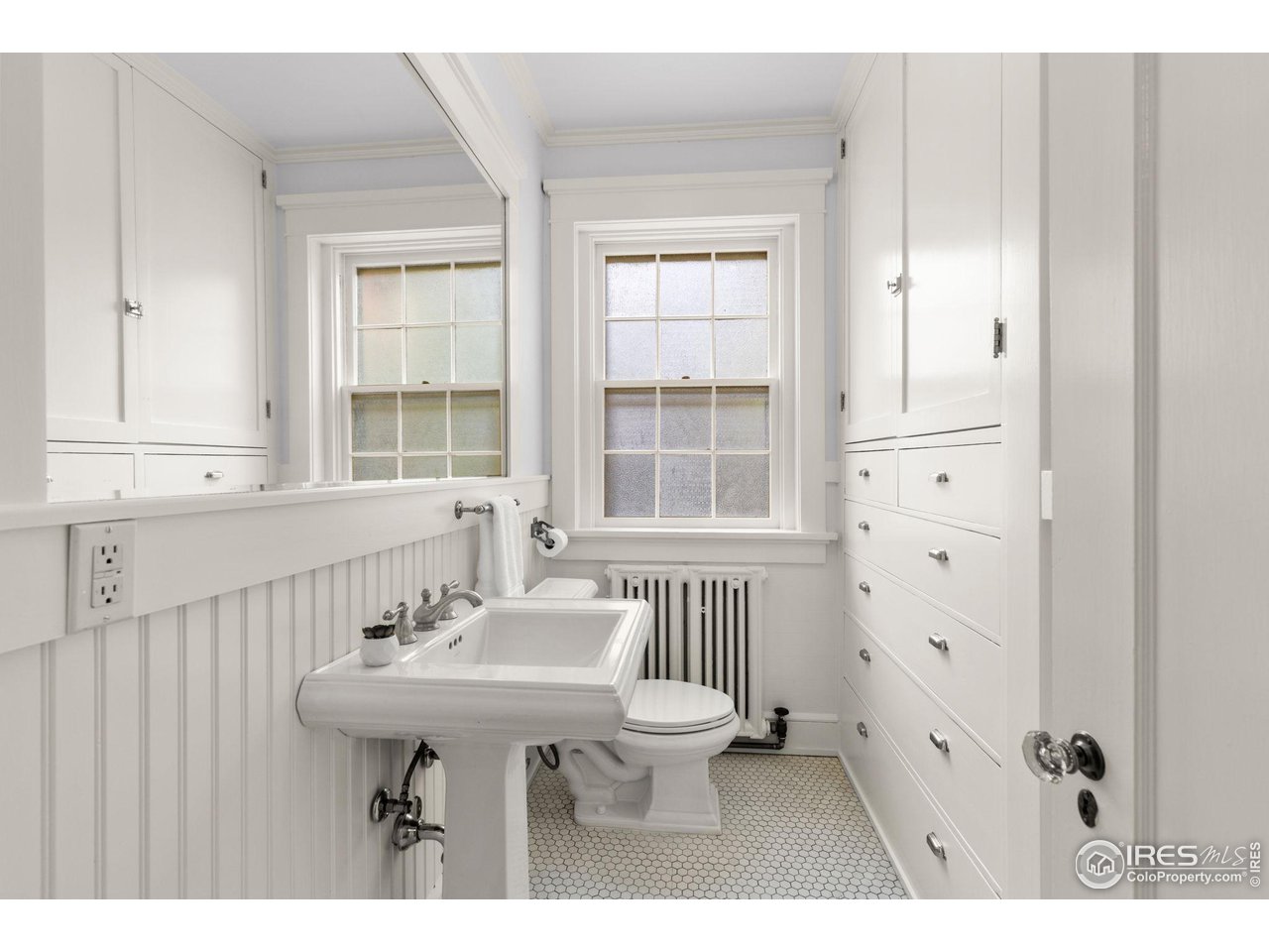 1064 10th Street Boulder, CO 80302 - Photo 9 of 40 a bathroom with a sink a toilet and a window