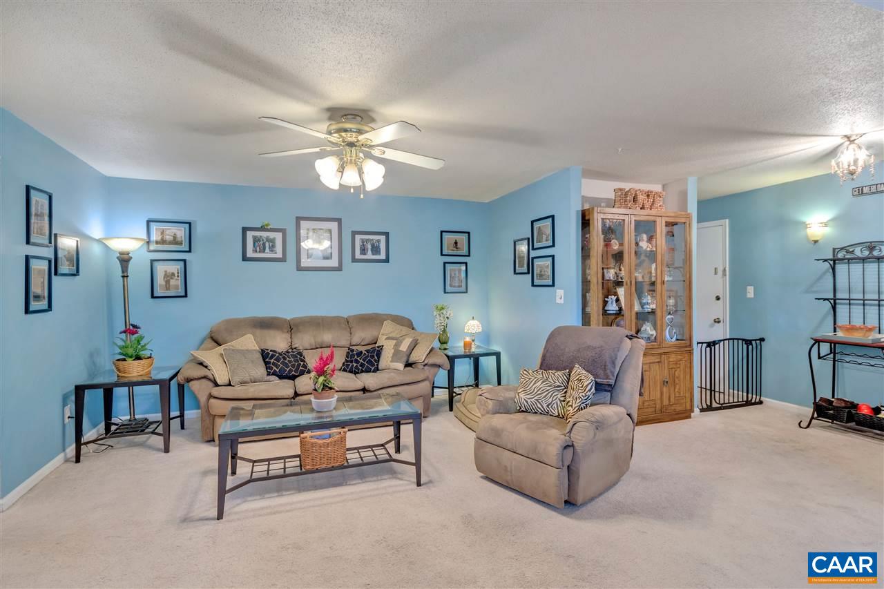 Spacious living room is open to the dining room and kitchen.