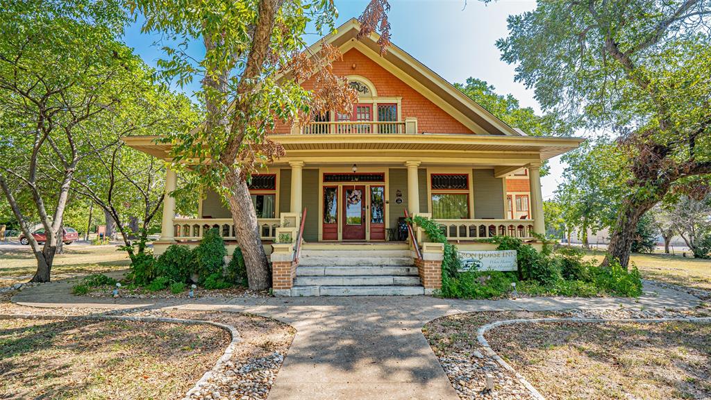 Victorian-style house with a porch