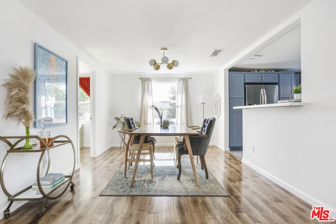 114 Hackett Place Los Angeles, CA 90042 - Photo 11 of 30 a view of a dining room with furniture window and wooden floor