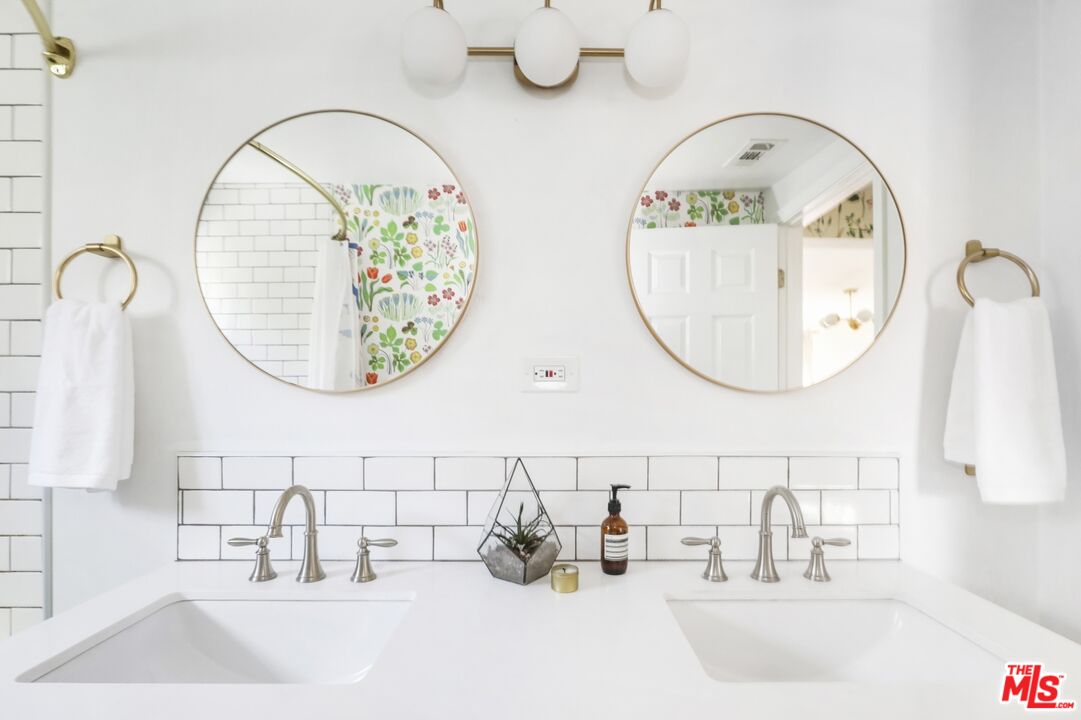 114 Hackett Place Los Angeles, CA 90042 - Photo 17 of 30 a bathroom with a sink and a mirror