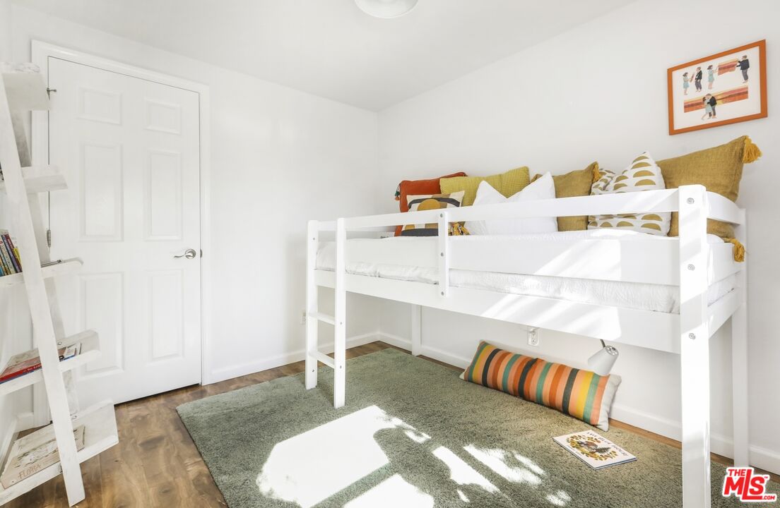 114 Hackett Place Los Angeles, CA 90042 - Photo 21 of 30 a bedroom with furniture and a bed