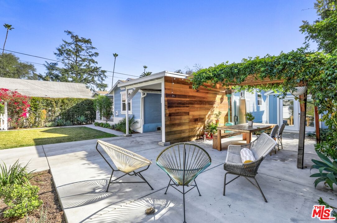114 Hackett Place Los Angeles, CA 90042 - Photo 22 of 30 a view of a chairs and table in patio with a fire pit
