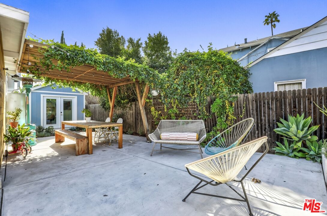 114 Hackett Place Los Angeles, CA 90042 - Photo 23 of 30 a view of a patio with couches table and chairs and potted plants