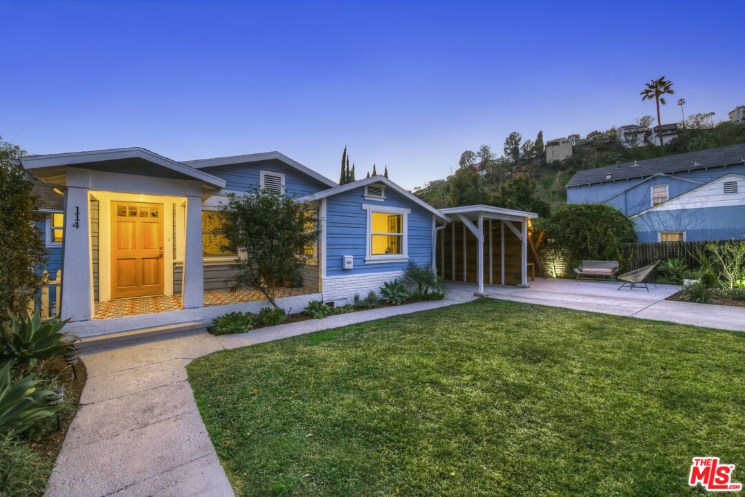 114 Hackett Place Los Angeles, CA 90042 - Photo 3 of 30 a front view of a house with a yard