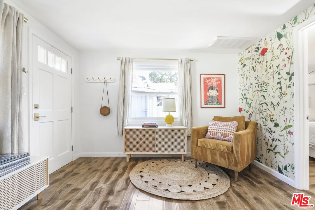 114 Hackett Place Los Angeles, CA 90042 - Photo 7 of 30 a living room with furniture and a table