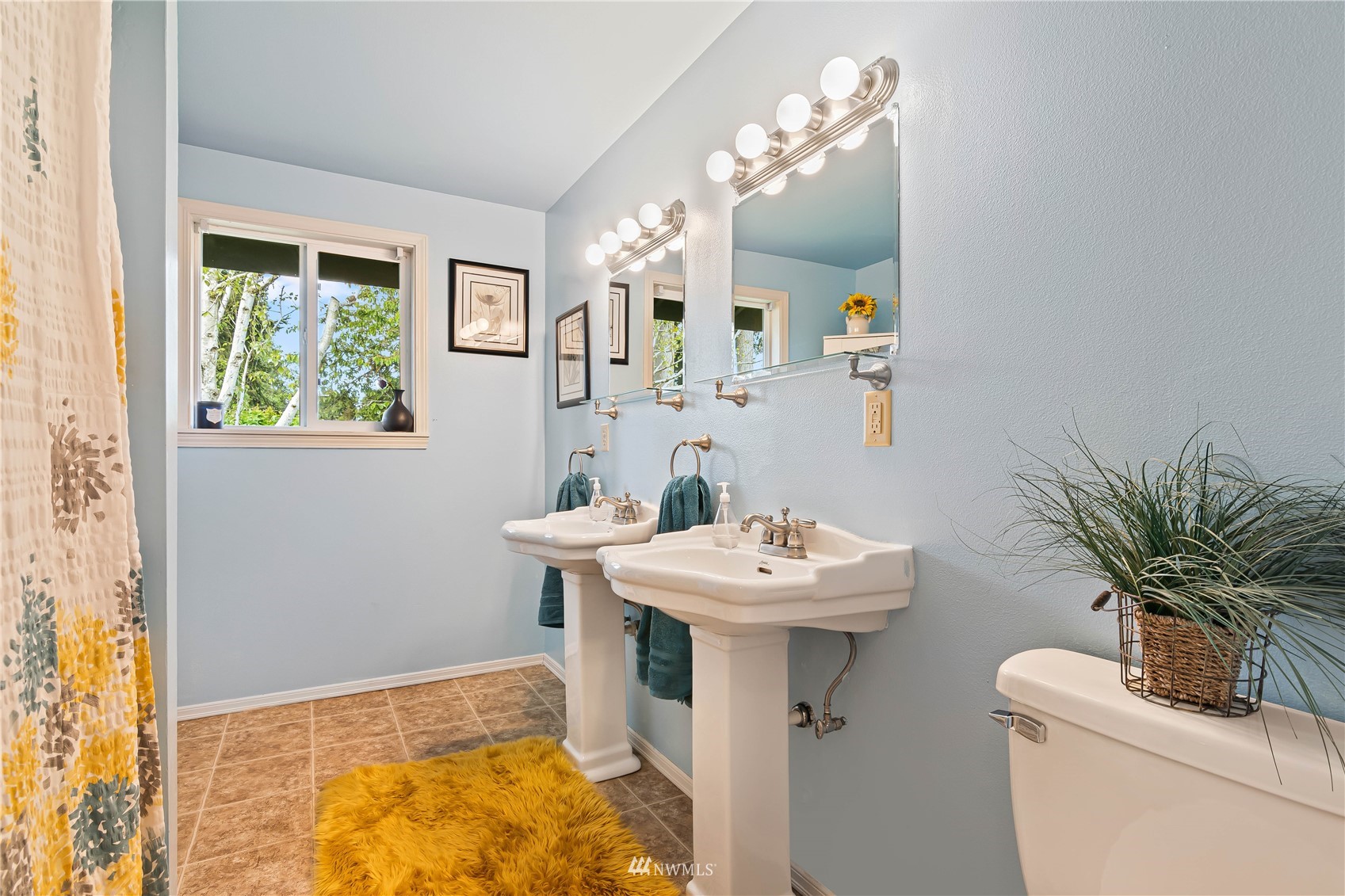 28513 24th Avenue South Federal Way, WA 98003 - Photo 17 of 31 a bathroom with a sink a mirror and a toilet