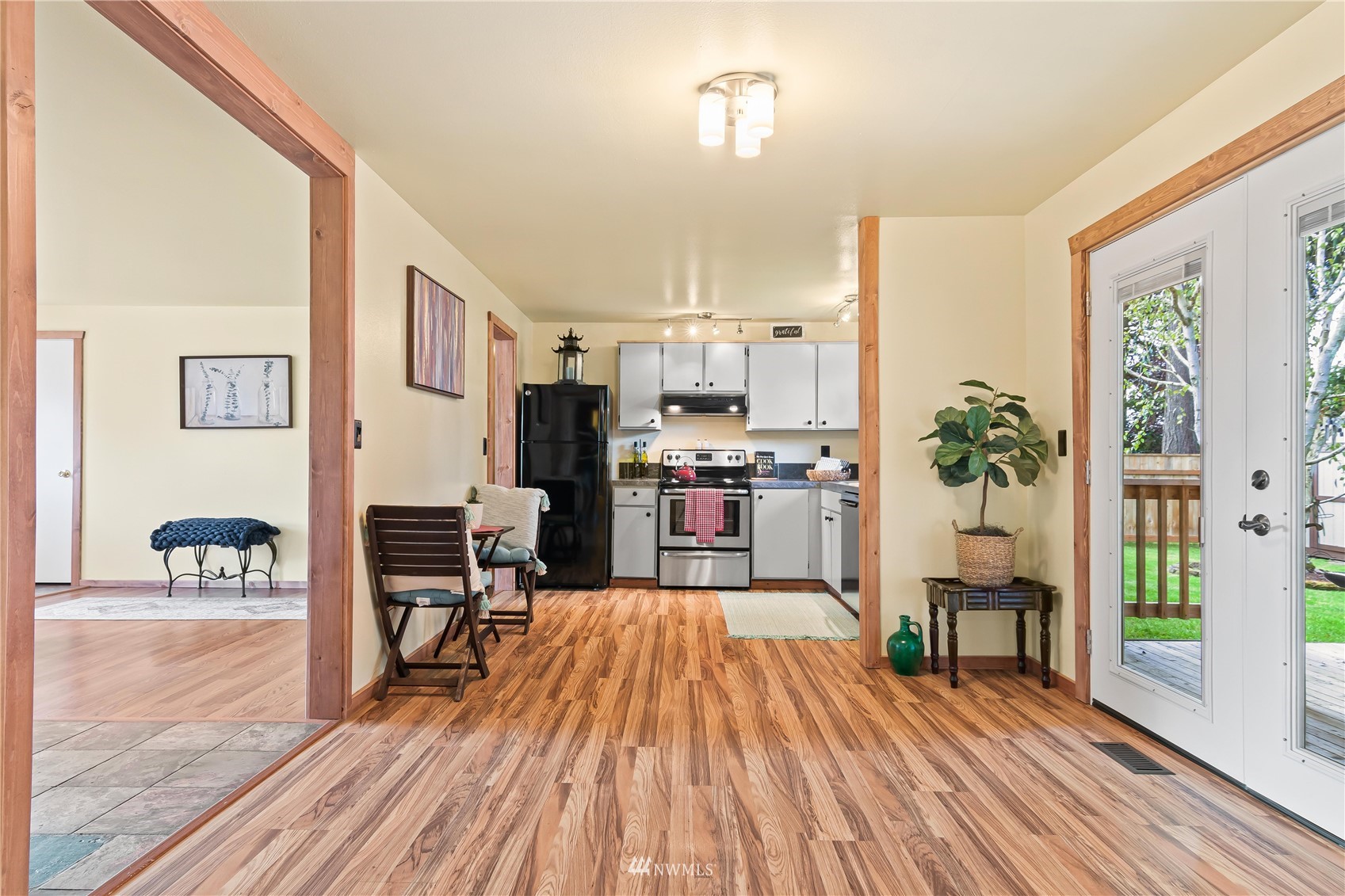 28513 24th Avenue South Federal Way, WA 98003 - Photo 7 of 31 a view of a living room kitchen with furniture and wooden floor