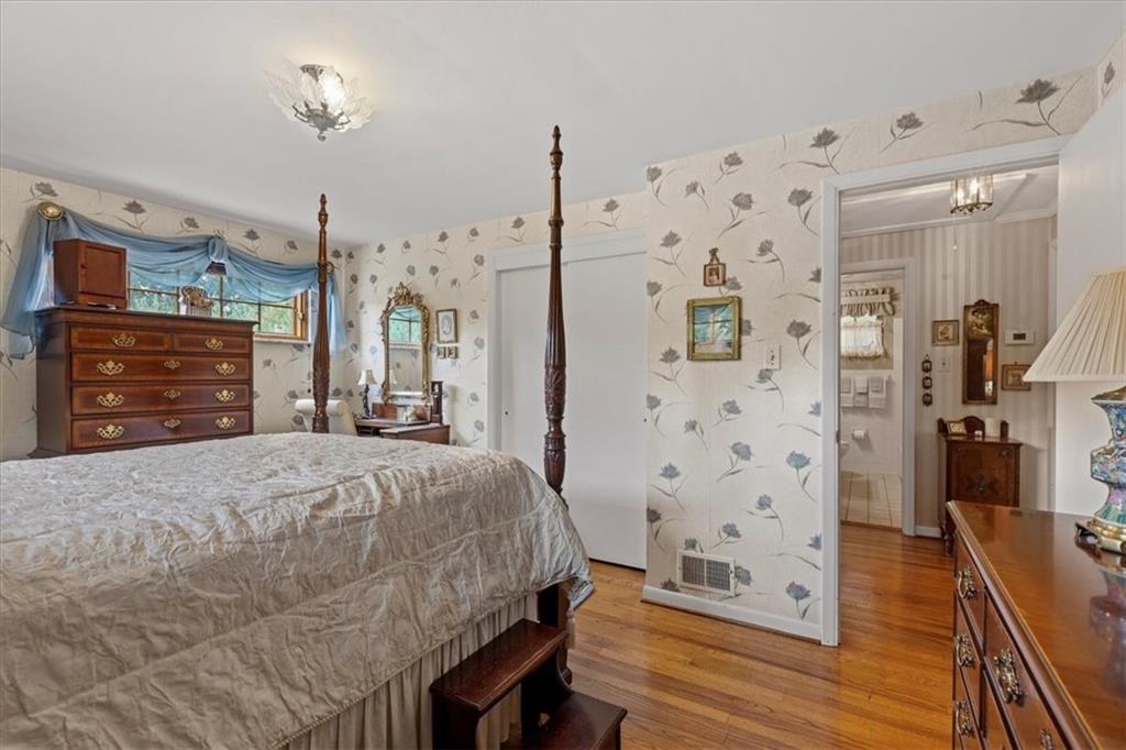 100 Morelli Drive Pittsburgh, PA 15237 - Photo 18 of 46 a bed room with a bed mirror and a dresser