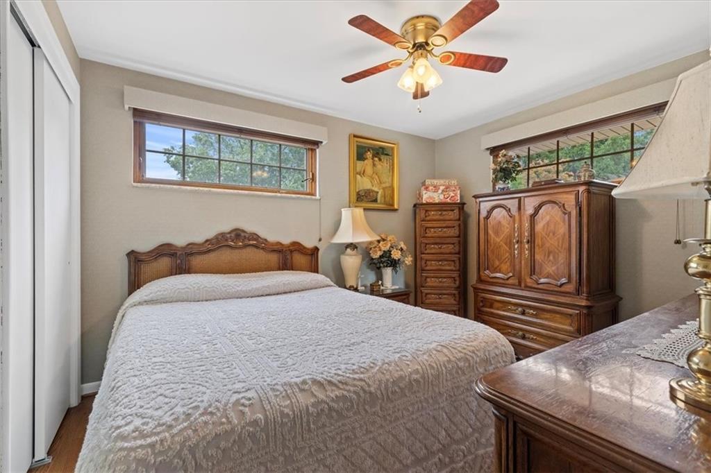 100 Morelli Drive Pittsburgh, PA 15237 - Photo 21 of 46 a bedroom with a bed and a chandelier