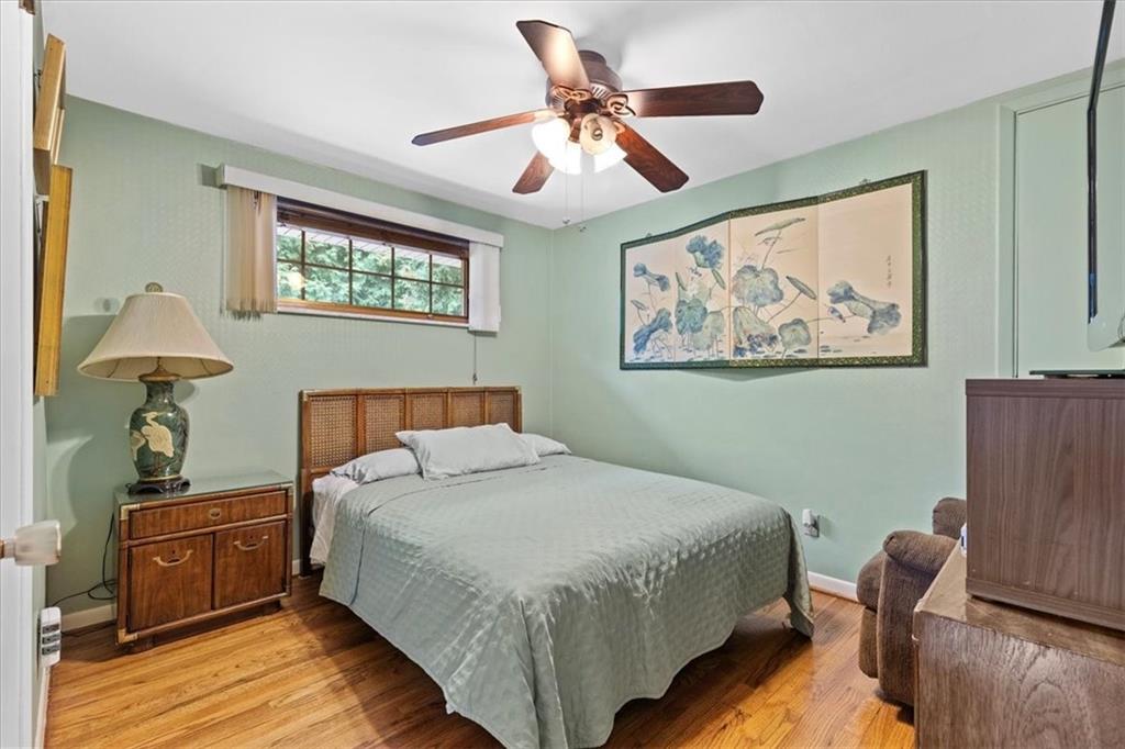 100 Morelli Drive Pittsburgh, PA 15237 - Photo 22 of 46 a bedroom with a bed and a painting on the wall