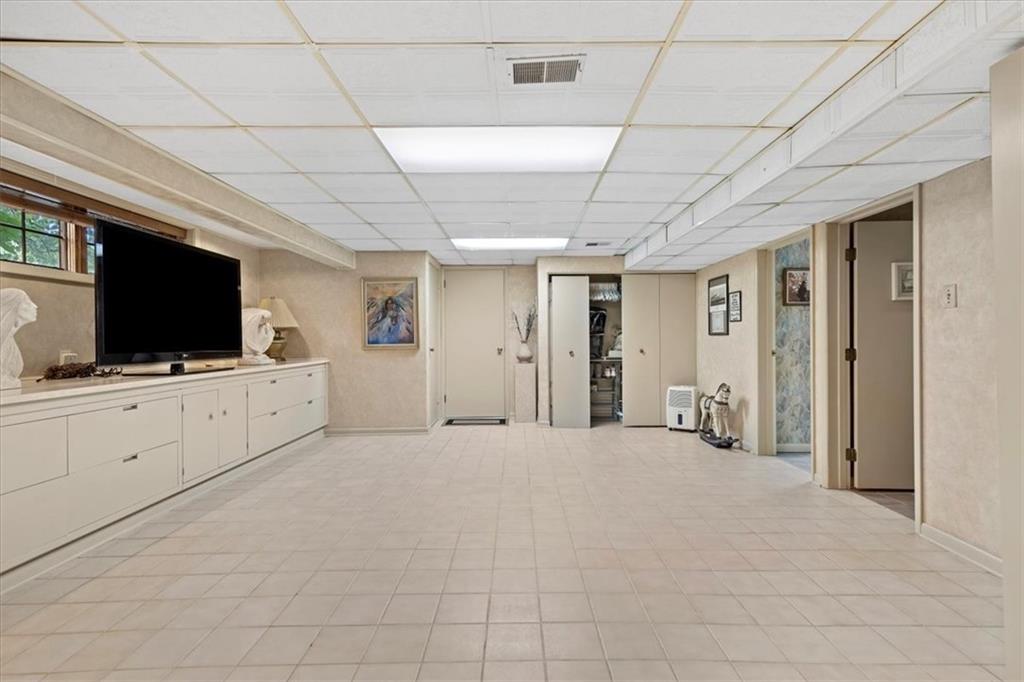100 Morelli Drive Pittsburgh, PA 15237 - Photo 25 of 46 a view of a livingroom with bathroom flat screen tv and windows