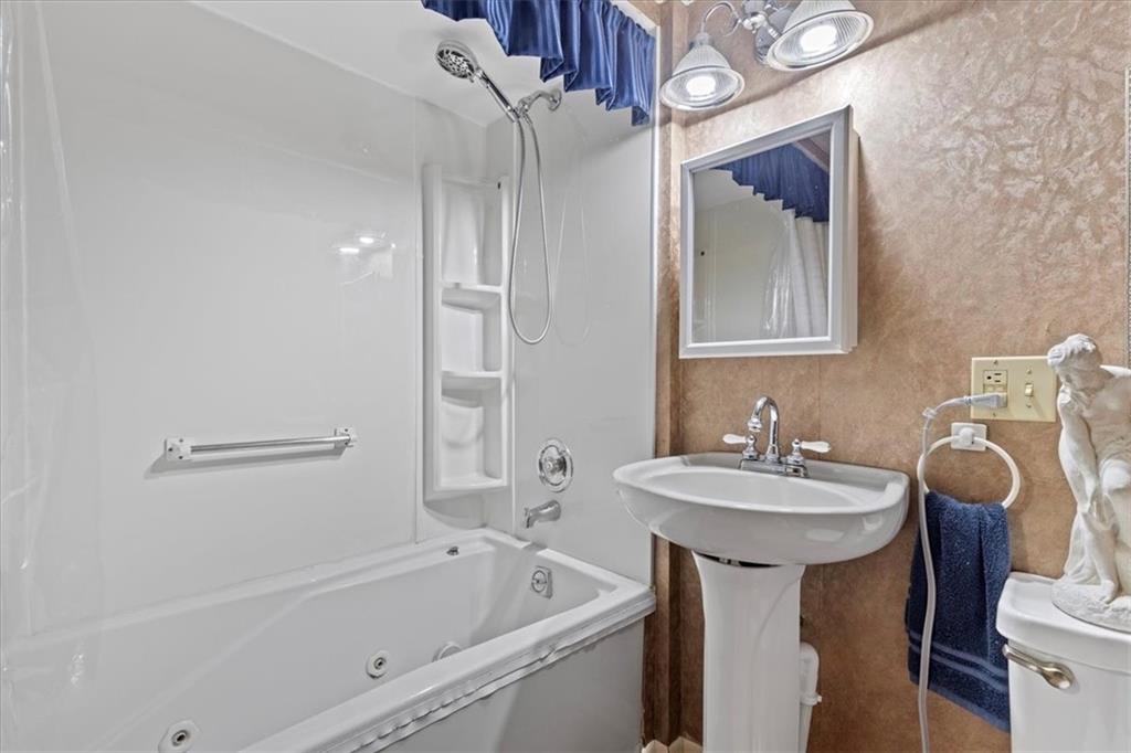 100 Morelli Drive Pittsburgh, PA 15237 - Photo 28 of 46 a bathroom with a sink vanity mirror bathtub and toilet
