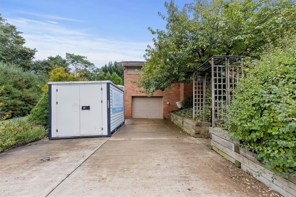 100 Morelli Drive Pittsburgh, PA 15237 - Photo 38 of 46 a view of a house with a yard and garage